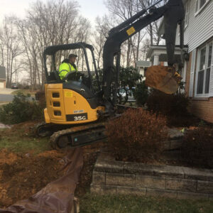 digging out a basement with an excavator for waterproofing in northern Virginia
